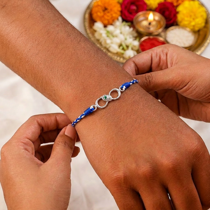 Unniyarcha 925 Sterling Silver Minimalist Mor Pankh Red Thread Rakhi with Chandan Tilak set