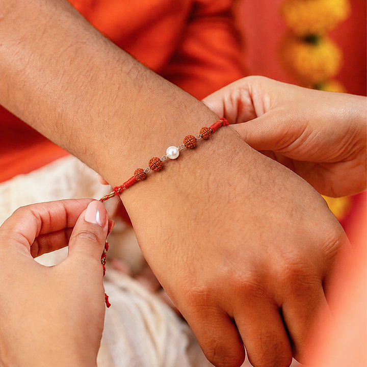 Unniyarcha 925 Pure Silver Elegant Pearl & Rudraksha Red Thread Rakhi with Chandan Tilak set