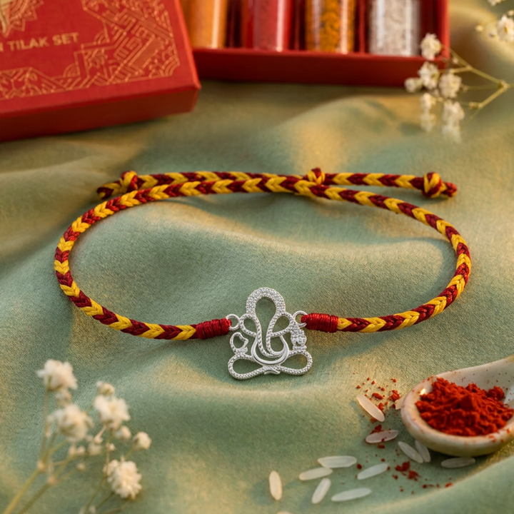 Pure 92.5 Lord Ganesha Silver Rakhi with Chandan Tilak Set