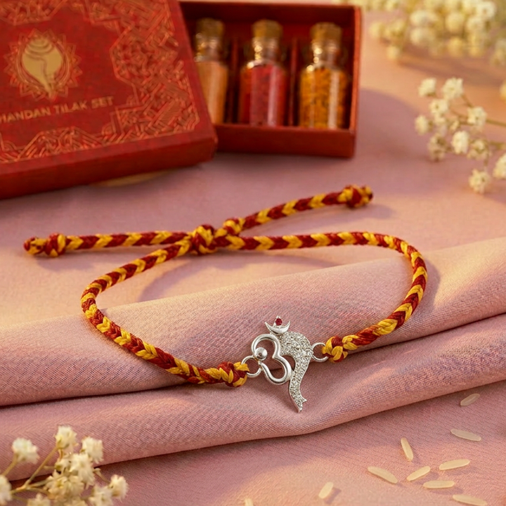 Pure 92.5 Silver Om with Ganesha Trunk Rakhi with Chandan Tilak Set