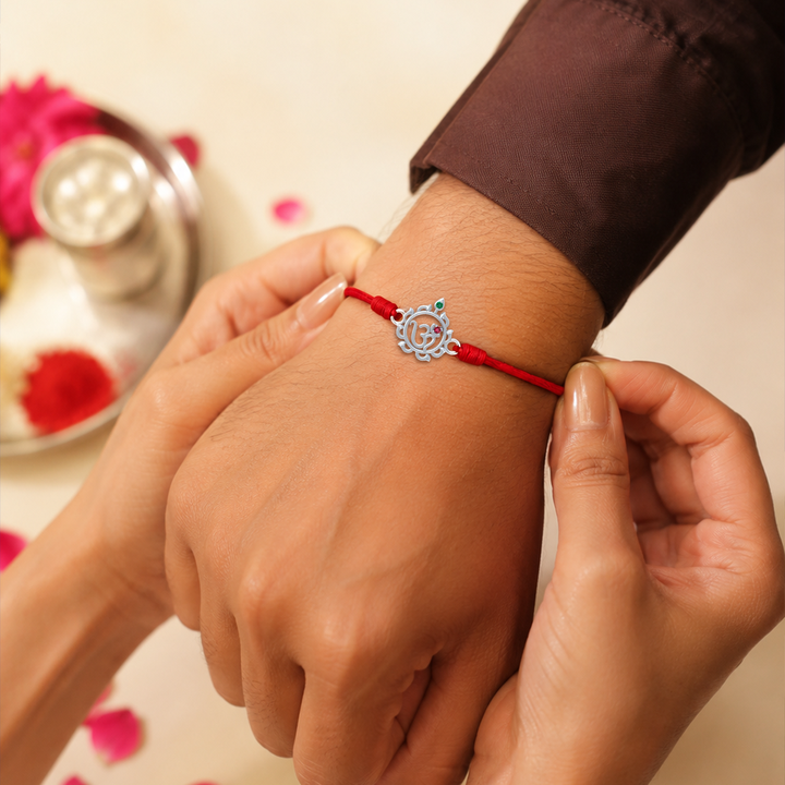 Unniyarcha 925 Pure Silver Om and Sudarshan Chakra Rakhi with Chandan Tilak set