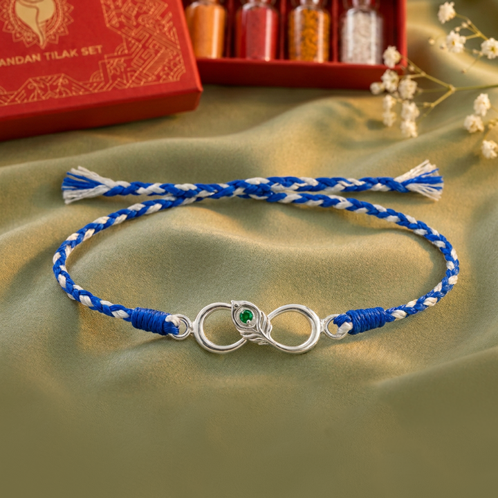 Unniyarcha 925 Sterling Silver Minimalist Mor Pankh Red Thread Rakhi with Chandan Tilak set